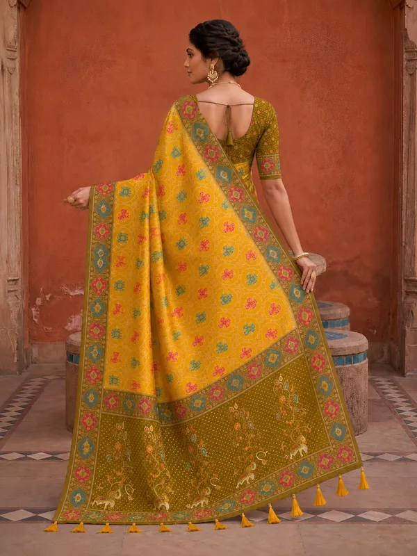 Yellow_Ajrakh_Printed_Designer_Patola_Saree_with_Contrast_Border_&_Tassel_Pallu