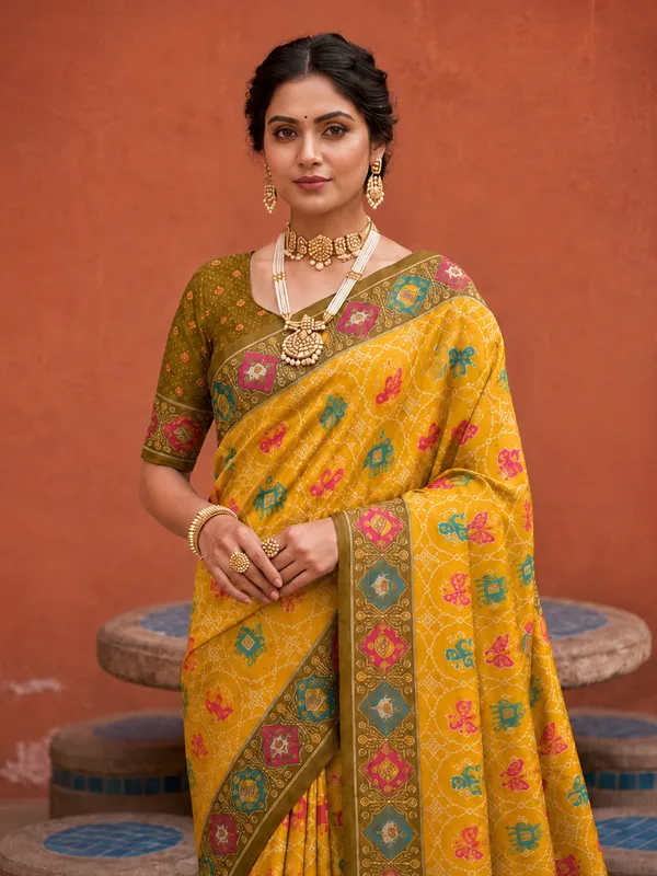 Yellow_Ajrakh_Printed_Designer_Patola_Saree_with_Contrast_Border_&_Tassel_Pallu