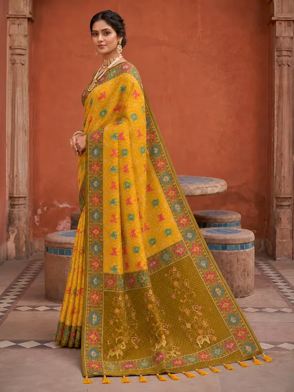 Yellow_Ajrakh_Printed_Designer_Patola_Saree_with_Contrast_Border_&_Tassel_Pallu