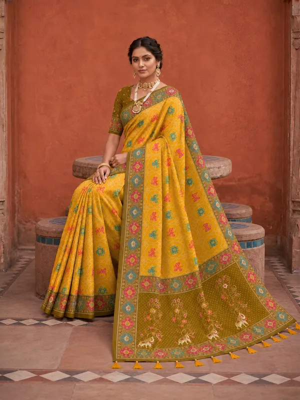 Yellow_Ajrakh_Printed_Designer_Patola_Saree_with_Contrast_Border_&_Tassel_Pallu
