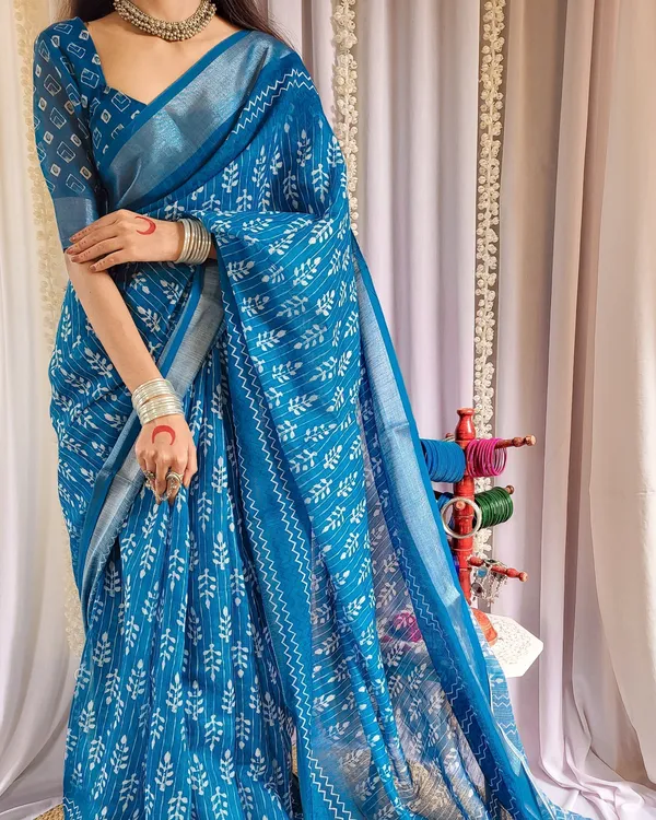 Elegant_Blue_Pure_Linen_Saree_with_Tassels_and_White_Floral_Patterns