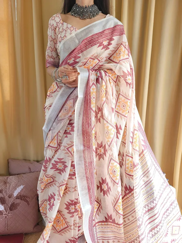 Ivory_Linen_Saree_with_Geometric_Tribal_Prints_&_Tassel_Accents
