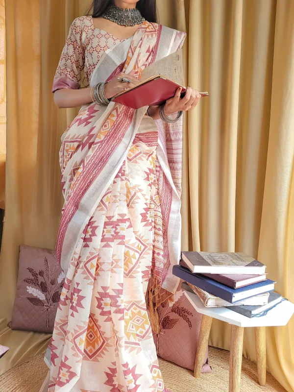 Ivory_Linen_Saree_with_Geometric_Tribal_Prints_&_Tassel_Accents