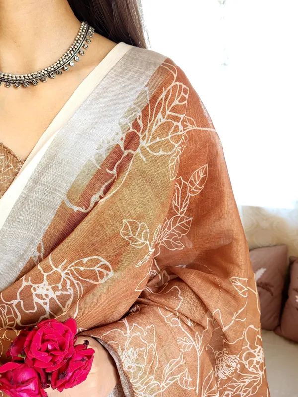 Rust_Brown_Pure_Linen_Saree_with_White_Floral_Motifs_and_Tassel_Detailing