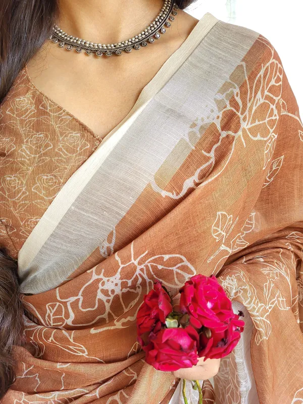 Rust_Brown_Pure_Linen_Saree_with_White_Floral_Motifs_and_Tassel_Detailing