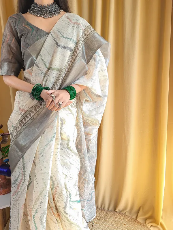 Elegant_Beige_Pure_Linen_Saree_with_Multicolor_Zigzag_Design_and_Tassel_Finish