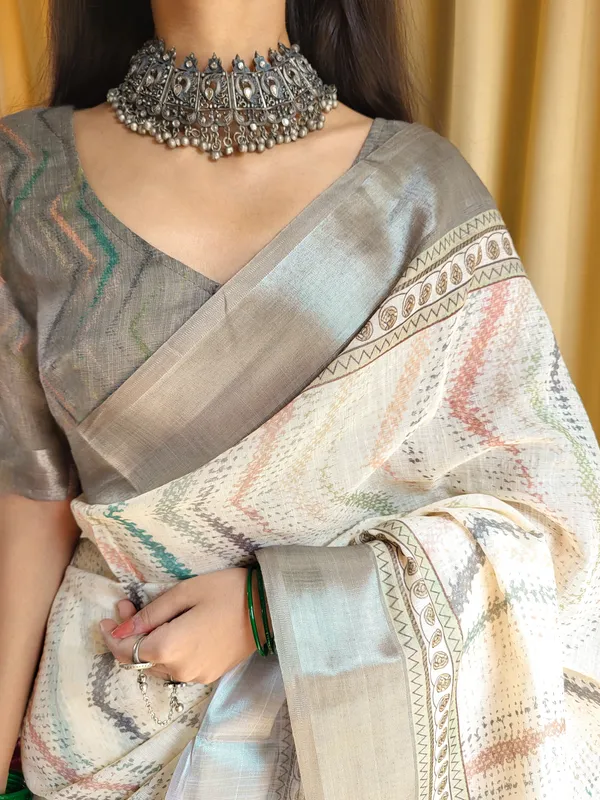 Elegant_Beige_Pure_Linen_Saree_with_Multicolor_Zigzag_Design_and_Tassel_Finish