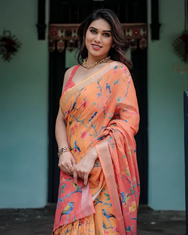 Peach_and_Orange_Pure_Cotton_Linen_Saree_with_Floral_and_Bird_Print,_Blouse,_and_Tassel_Detailing