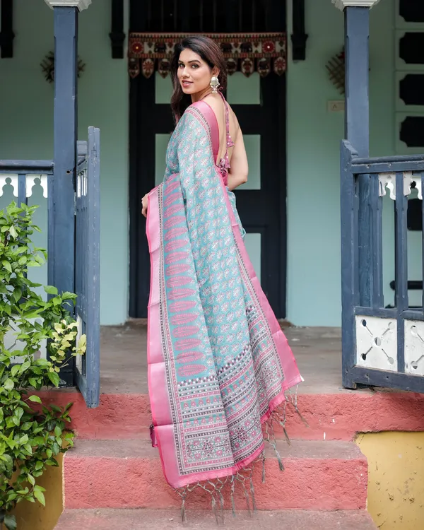 Aqua_Blue_Pure_Cotton_Linen_Saree_with_Pink_Border,_Floral_Motifs,_and_Tassel_Detailing