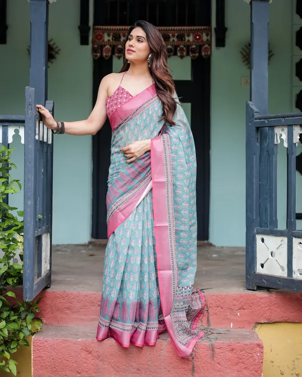Aqua_Blue_Pure_Cotton_Linen_Saree_with_Pink_Border,_Floral_Motifs,_and_Tassel_Detailing