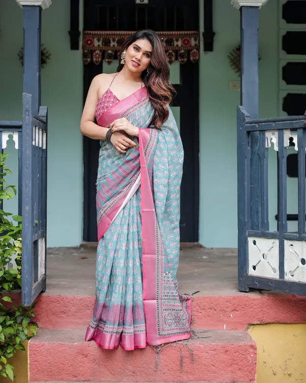 Aqua_Blue_Pure_Cotton_Linen_Saree_with_Pink_Border,_Floral_Motifs,_and_Tassel_Detailing