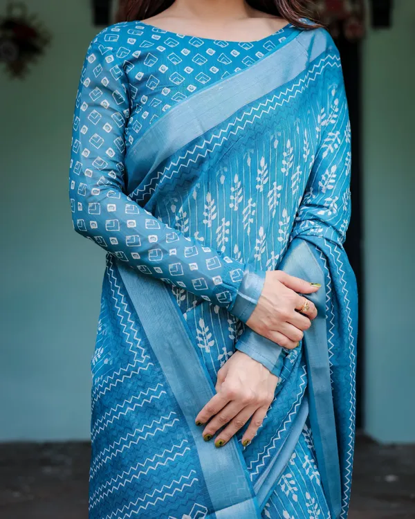Turquoise_Pure_Cotton_Linen_Saree_with_White_Floral_Design,_Blouse,_and_Tassel_Edges