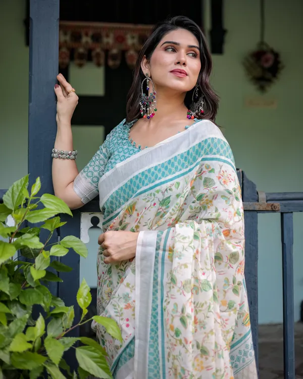 Elegant_Floral_Printed_Pure_Cotton_Linen_Saree_in_Ivory_with_Teal_Border_and_Blouse,_Tassels_on_Edges