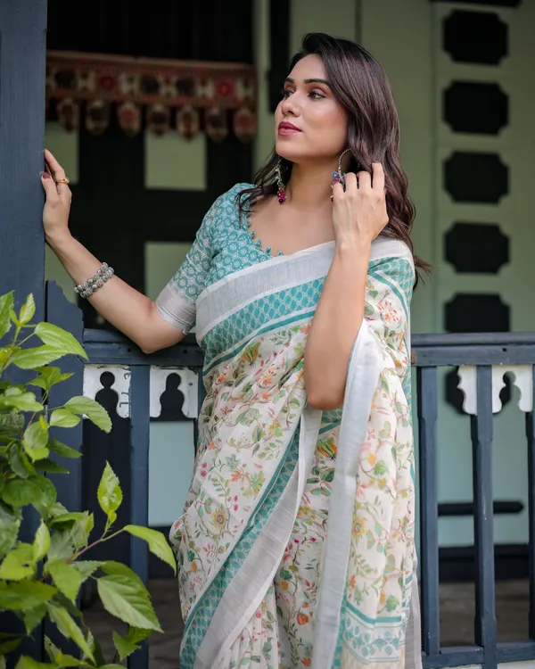Elegant_Floral_Printed_Pure_Cotton_Linen_Saree_in_Ivory_with_Teal_Border_and_Blouse,_Tassels_on_Edges