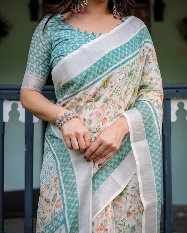 Elegant_Floral_Printed_Pure_Cotton_Linen_Saree_in_Ivory_with_Teal_Border_and_Blouse,_Tassels_on_Edges