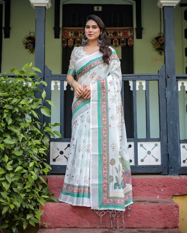 Ivory_Pure_Cotton_Linen_Saree_with_Elephant_Motif_and_Floral_Pattern,_Green_and_Pink_Borders,_and_Tassels_on_Edges.