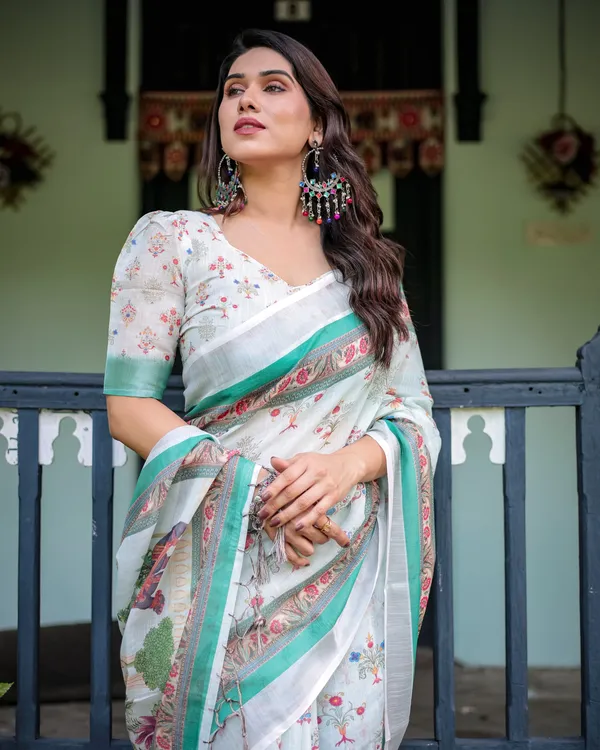 Ivory_Pure_Cotton_Linen_Saree_with_Elephant_Motif_and_Floral_Pattern,_Green_and_Pink_Borders,_and_Tassels_on_Edges.