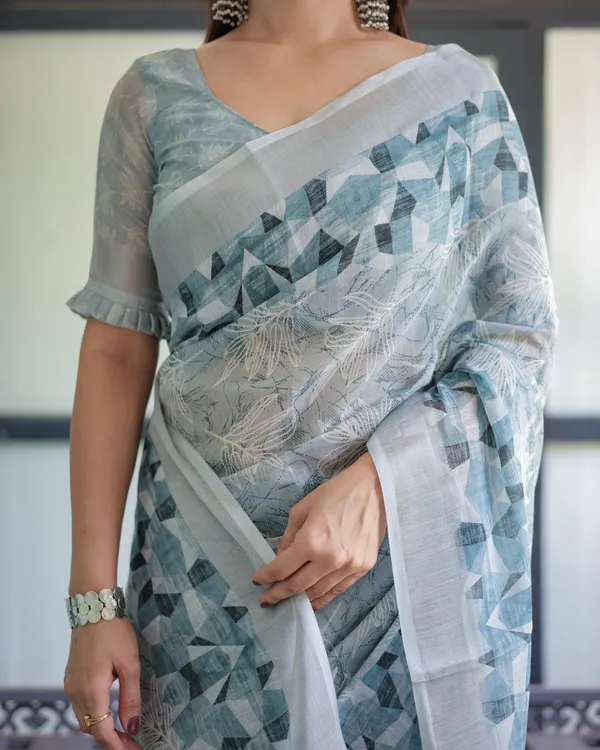 Light_Blue_Pure_Cotton_Linen_Saree_with_Geometric_and_Floral_Patterns,_Blouse,_and_Tassels