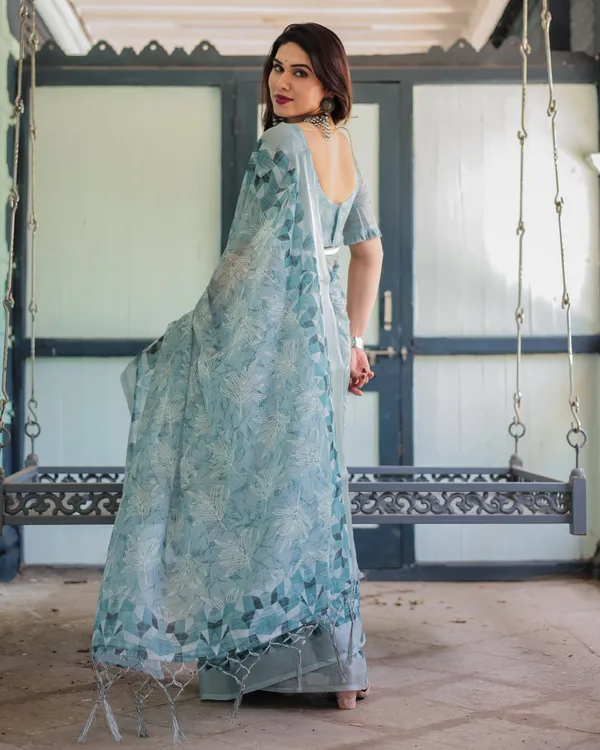Light_Blue_Pure_Cotton_Linen_Saree_with_Geometric_and_Floral_Patterns,_Blouse,_and_Tassels
