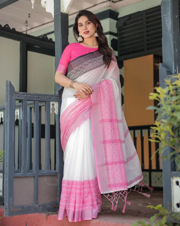 Elegant_White_and_Pink_Pure_Cotton_Linen_Saree_with_Intricate_Floral_and_Geometric_Border_Design_and_Tassels_on_Edges