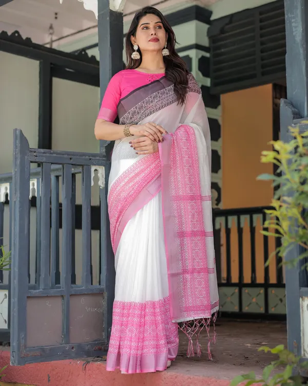 Elegant_White_and_Pink_Pure_Cotton_Linen_Saree_with_Intricate_Floral_and_Geometric_Border_Design_and_Tassels_on_Edges