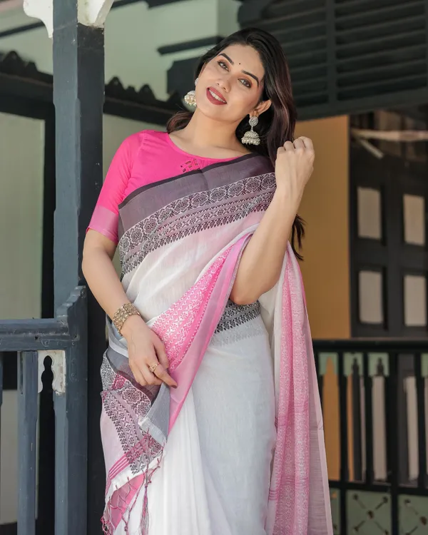 Elegant_White_and_Pink_Pure_Cotton_Linen_Saree_with_Intricate_Floral_and_Geometric_Border_Design_and_Tassels_on_Edges