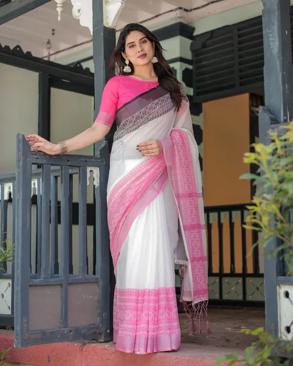Elegant_White_and_Pink_Pure_Cotton_Linen_Saree_with_Intricate_Floral_and_Geometric_Border_Design_and_Tassels_on_Edges