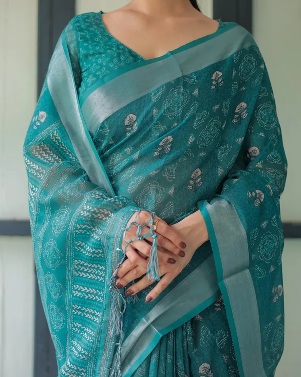 Teal_Green_Pure_Cotton_Linen_Saree_with_Silver_Floral_Motifs_and_Tassels