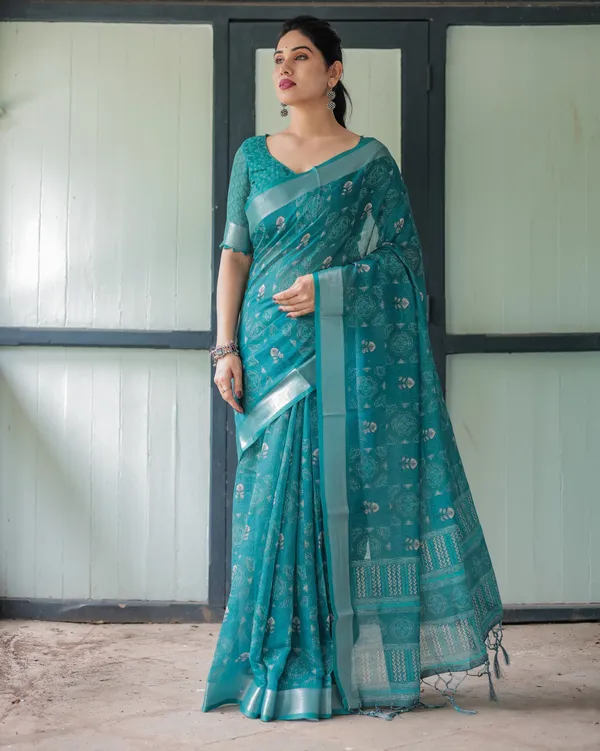 Teal_Green_Pure_Cotton_Linen_Saree_with_Silver_Floral_Motifs_and_Tassels