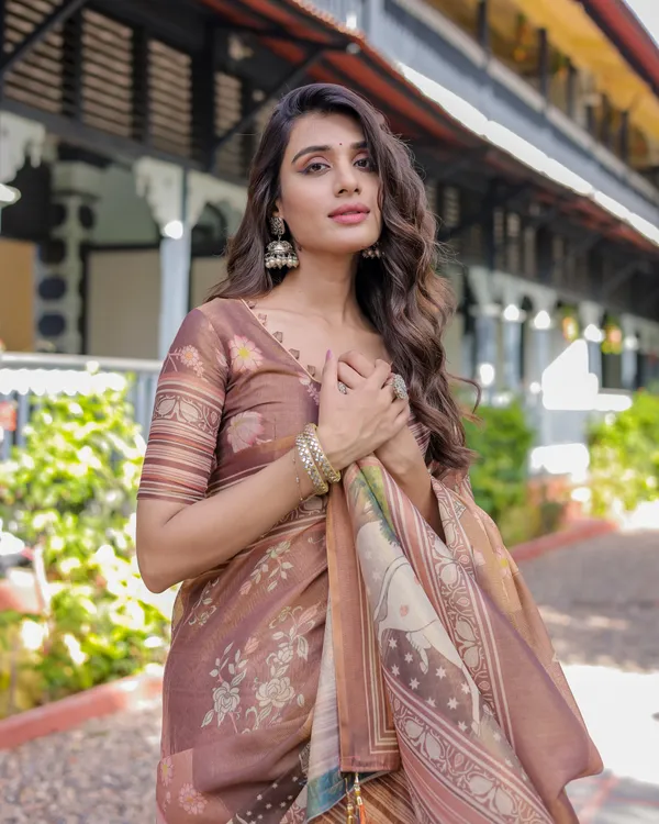 Divine_Brown_Handloom_Cotton_Saree_with_Radha_Krishna_&_Cow_Motif_–_Ethnic_Village_Charm