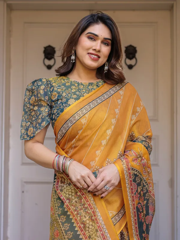 Mustard_Yellow_&_Teal_Green_Floral_Panel_Printed_Handloom_Cotton_Saree_with_Heritage_Border_&_Tassels_–_Festive_Traditional_Wear