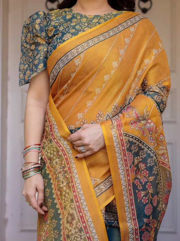 Mustard_Yellow_&_Teal_Green_Floral_Panel_Printed_Handloom_Cotton_Saree_with_Heritage_Border_&_Tassels_–_Festive_Traditional_Wear