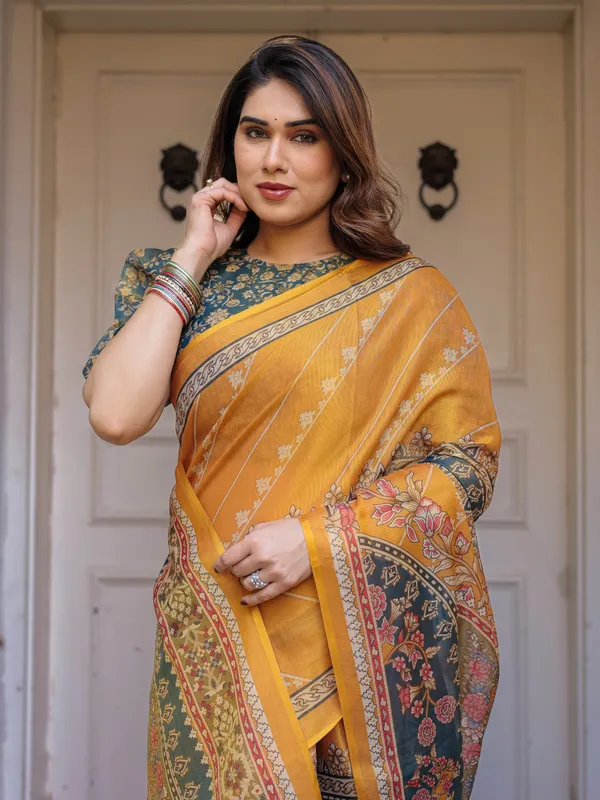 Mustard_Yellow_&_Teal_Green_Floral_Panel_Printed_Handloom_Cotton_Saree_with_Heritage_Border_&_Tassels_–_Festive_Traditional_Wear