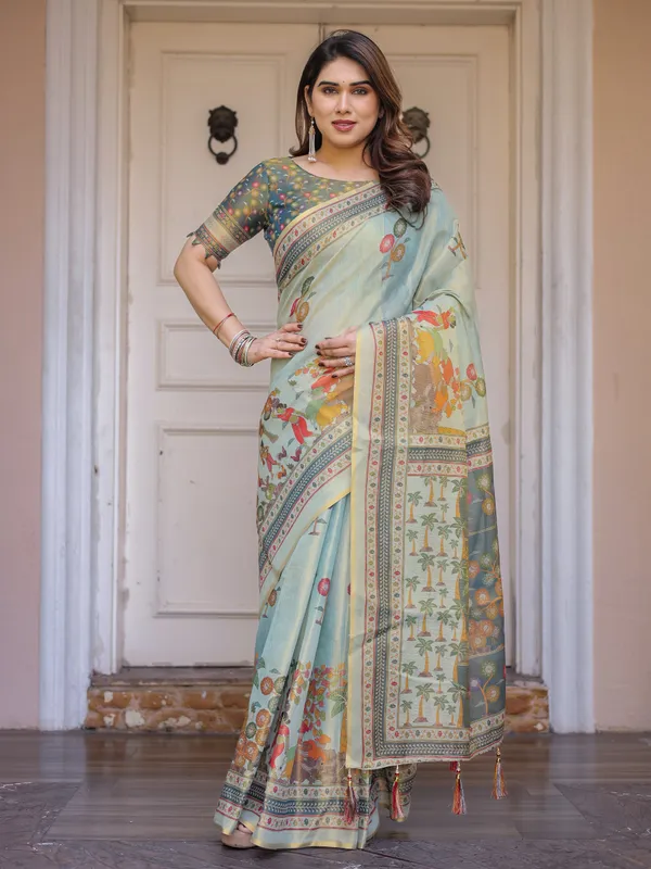 Mint_Green_Folk_Printed_Handloom_Cotton_Saree_with_Village_Scene_Panel_Pallu,_Ornamental_Border_&_Tassels_–_Traditional_Ethnic_Wear