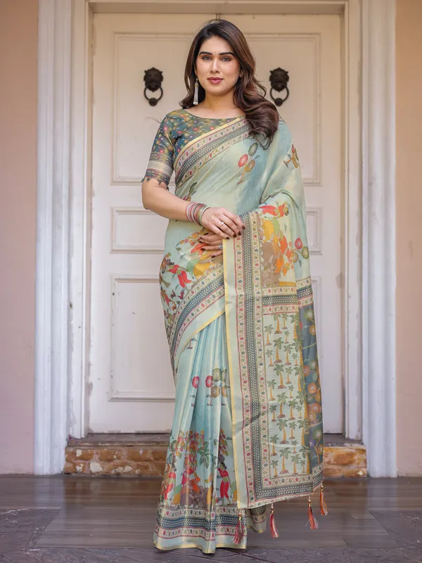 Mint_Green_Folk_Printed_Handloom_Cotton_Saree_with_Village_Scene_Panel_Pallu,_Ornamental_Border_&_Tassels_–_Traditional_Ethnic_Wear