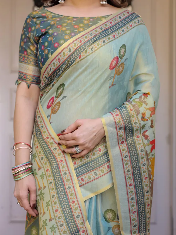 Mint_Green_Folk_Printed_Handloom_Cotton_Saree_with_Village_Scene_Panel_Pallu,_Ornamental_Border_&_Tassels_–_Traditional_Ethnic_Wear