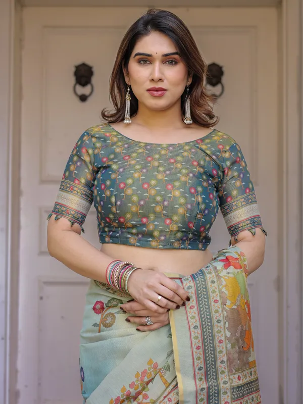 Mint_Green_Folk_Printed_Handloom_Cotton_Saree_with_Village_Scene_Panel_Pallu,_Ornamental_Border_&_Tassels_–_Traditional_Ethnic_Wear