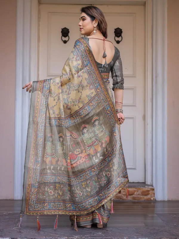 Beige_&_Olive_Green_Floral_Printed_Handloom_Cotton_Saree_with_Heritage_Panel_Pallu,_Ornamental_Border_&_Tassels_–_Elegant_Ethnic_Wear