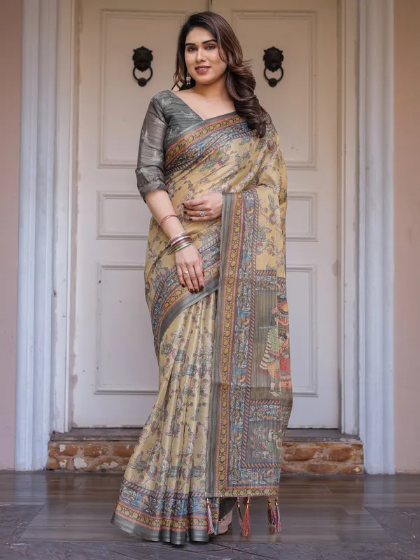 Beige_&_Olive_Green_Floral_Printed_Handloom_Cotton_Saree_with_Heritage_Panel_Pallu,_Ornamental_Border_&_Tassels_–_Elegant_Ethnic_Wear
