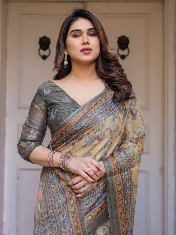 Beige_&_Olive_Green_Floral_Printed_Handloom_Cotton_Saree_with_Heritage_Panel_Pallu,_Ornamental_Border_&_Tassels_–_Elegant_Ethnic_Wear