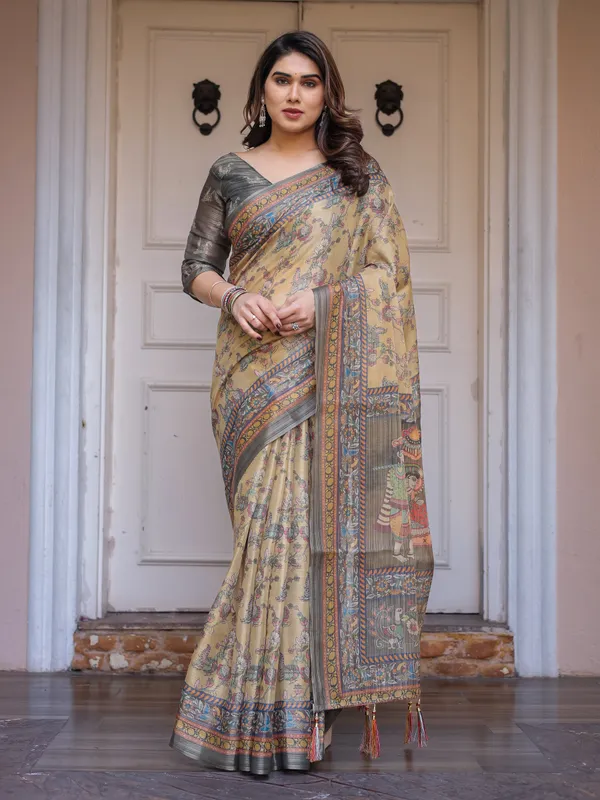 Beige_&_Olive_Green_Floral_Printed_Handloom_Cotton_Saree_with_Heritage_Panel_Pallu,_Ornamental_Border_&_Tassels_–_Elegant_Ethnic_Wear