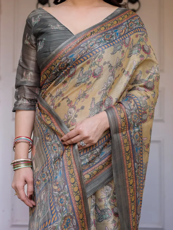 Beige_&_Olive_Green_Floral_Printed_Handloom_Cotton_Saree_with_Heritage_Panel_Pallu,_Ornamental_Border_&_Tassels_–_Elegant_Ethnic_Wear