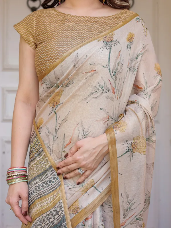 Beige_&_Mustard_Botanical_Handloom_Cotton-Linen_Saree_with_Ethnic_Striped_Pallu_&_Tassels_–_Graceful_Traditional_Wear
