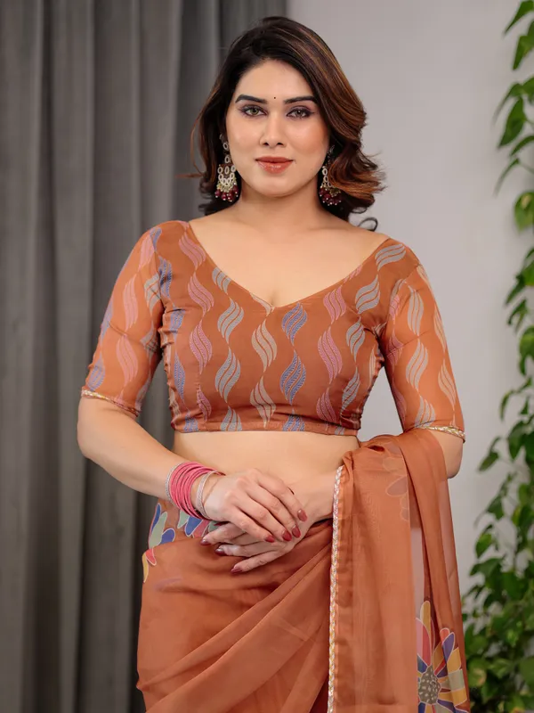 Rust_Orange_Floral_Printed_Organza_Saree_with_Multicolour_Lace_Border_|_Lightweight_Designer_Organza_Saree_with_Attached_Blouse_Piece_|_Elegant_Festive_&_Party_Wear_Saree