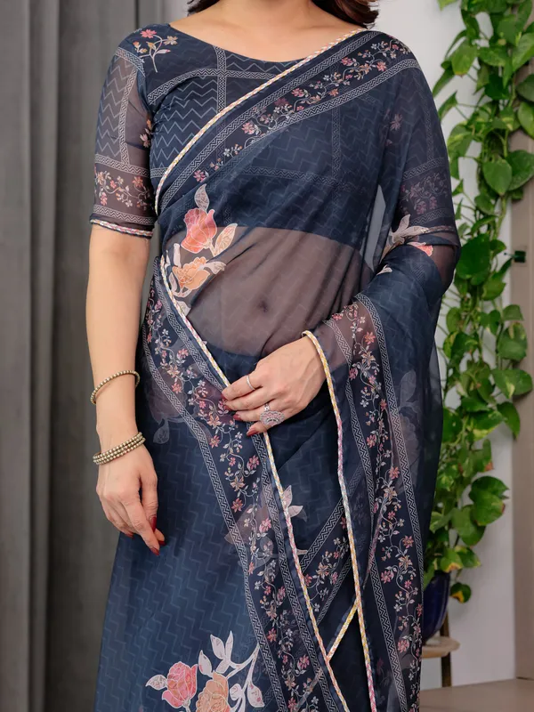 Midnight_Blue_Floral_Printed_Organza_Saree_with_Elegant_Floral_Border_&_Multicolour_Lace_Edges_|_Designer_Lightweight_Organza_Saree_with_Attached_Blouse_Piece_|_Festive_&_Party_Wear_Saree