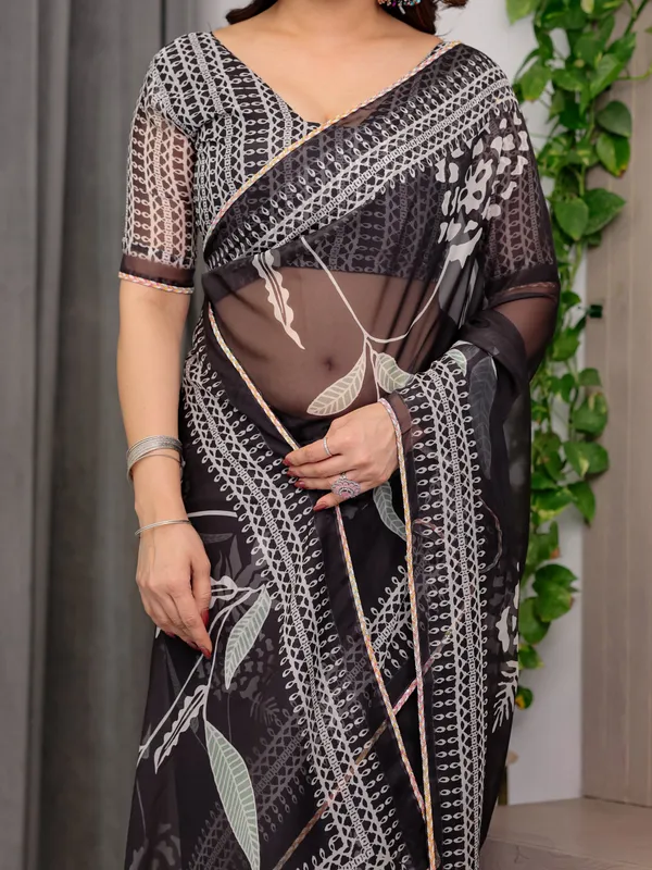 Elegant_Black_Floral_Printed_Organza_Saree_with_Intricate_Ethnic_Border_&_Multicolour_Lace_Edges_|_Lightweight_Designer_Organza_Saree_with_Attached_Blouse_Piece_|_Festive_&_Party_Wear_Saree