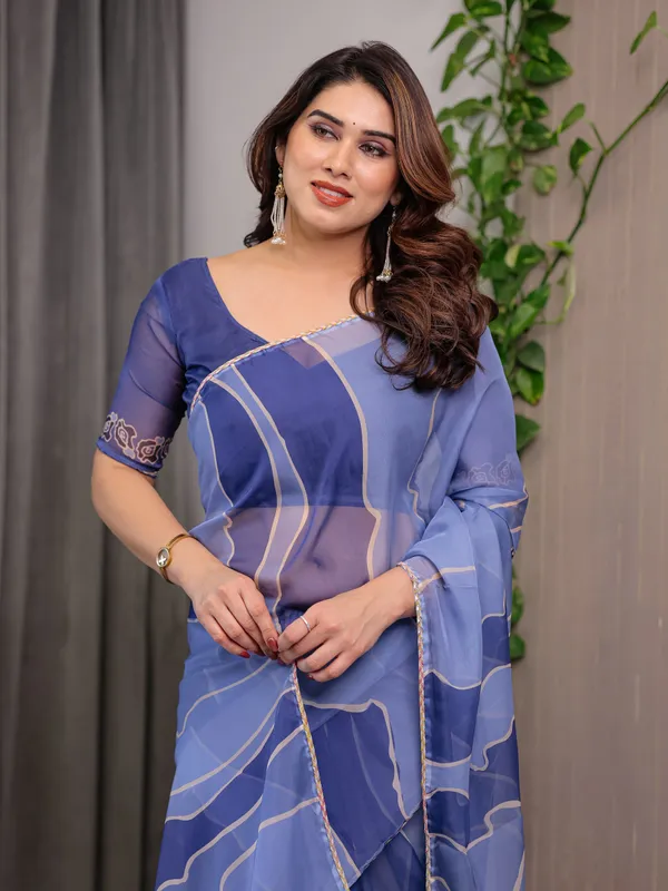 Elegant_Steel_Blue_Printed_Organza_Saree_with_Abstract_Wave_Motifs_&_Multicolour_Lace_Border_|_Designer_Lightweight_Organza_Saree_with_Attached_Blouse_Piece_|_Contemporary_Festive_Wear_Saree