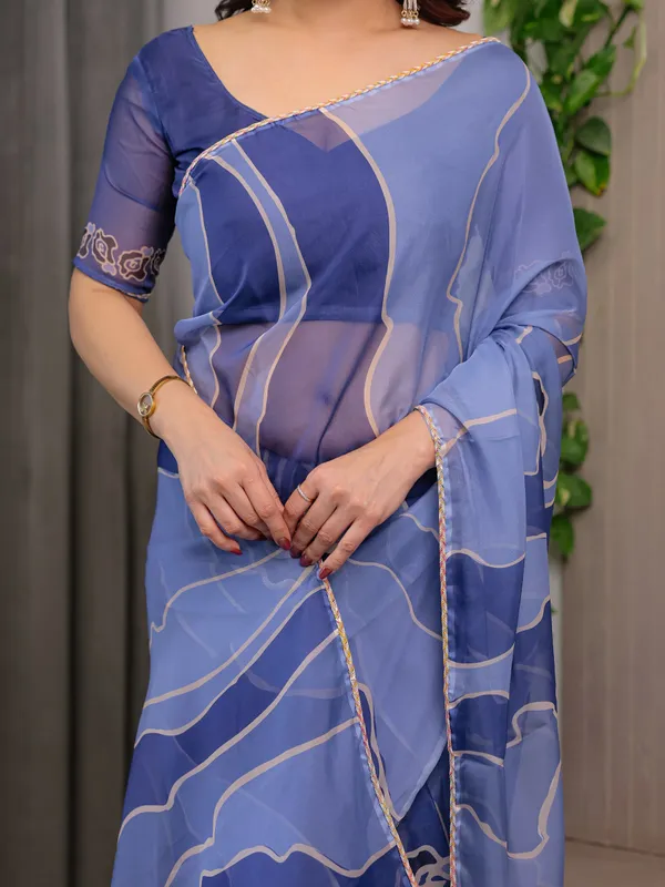 Elegant_Steel_Blue_Printed_Organza_Saree_with_Abstract_Wave_Motifs_&_Multicolour_Lace_Border_|_Designer_Lightweight_Organza_Saree_with_Attached_Blouse_Piece_|_Contemporary_Festive_Wear_Saree