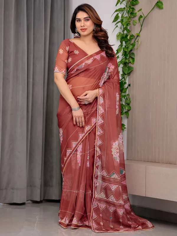 Rust_Terracotta_Printed_Organza_Saree_with_Mandala_Motifs_&_Geometric_Border_|_Designer_Lightweight_Organza_Saree_with_Multicolour_Lace_Edge_|_Festive_&_Party_Wear_Saree