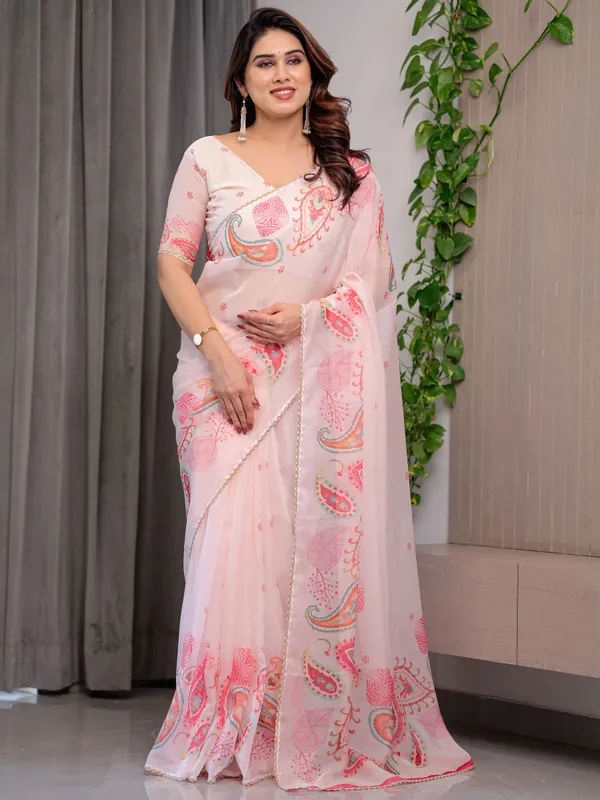 Pastel_Peach_Printed_Organza_Saree_with_Paisley_Motifs_&_Multicolour_Lace_Border_|_Designer_Lightweight_Organza_Saree_with_Attached_Blouse_Piece_|_Elegant_Festive_&_Party_Wear_Saree